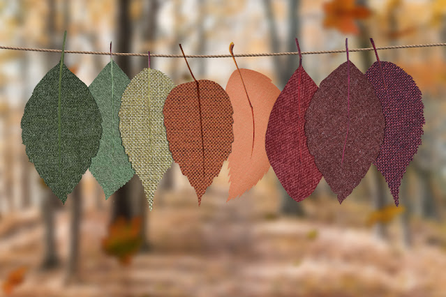 Different coloured fabric leaves hung along a string. Image by design ecologist from unsplash.com