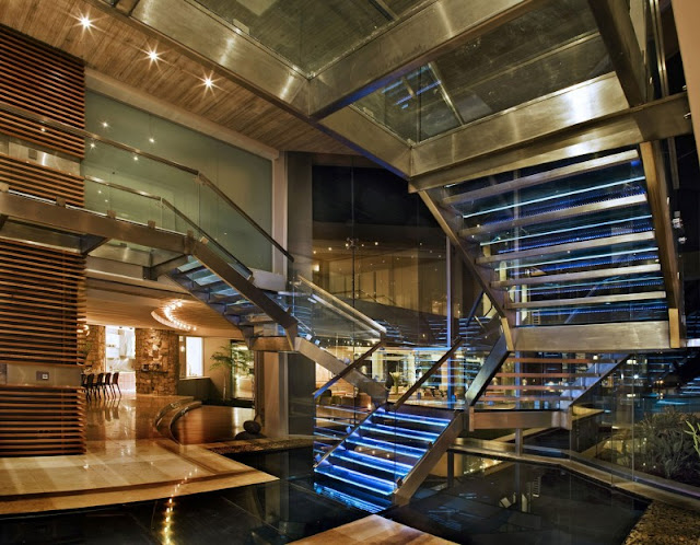 Photo of incredible glass staircase as seen from the ground floor