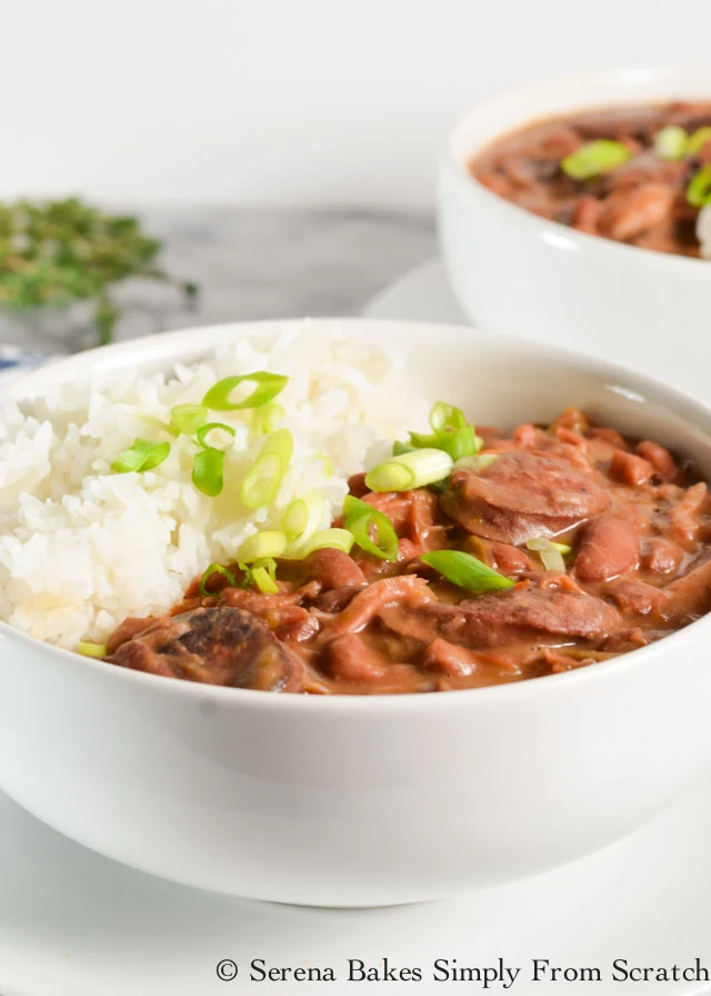 Meaty Red Beans and Rice recipe with ham hock and andouille sausage is a favorite for dinner from Serena Bakes Simply From Scratch.