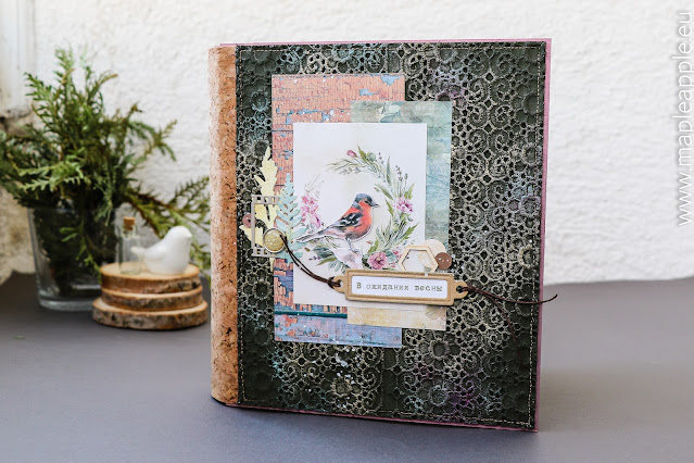 Handmade scrapbook album with bird picture on the cover, cork spine, mixed media layout on dark color cover