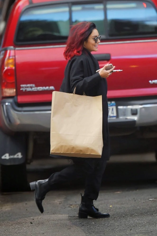 Vanessa Hudgens flaunts red hair and an all black outfit out and about in Soho