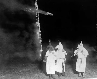 Ku Klux Klan members burning a cross, Denver