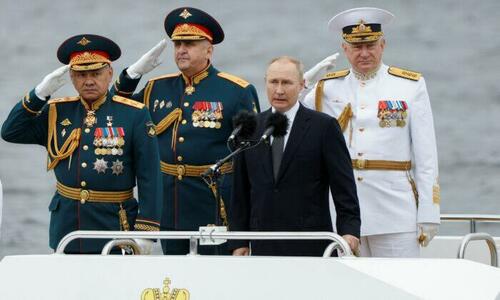 Russian President Vladimir Putin (2nd R) stands with three Russian naval officers at a parade marking Navy Day in St. Petersburg, Russia, on July 31, 2022.