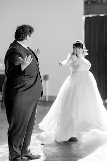 Bride challenges her partner to a dance off during wedding reception in portland oregon