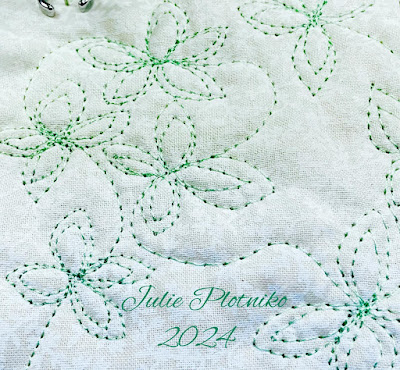 Free Motion Quilting in light green thread on white