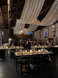 White sheer drapes suspended over the main room at The Green Building