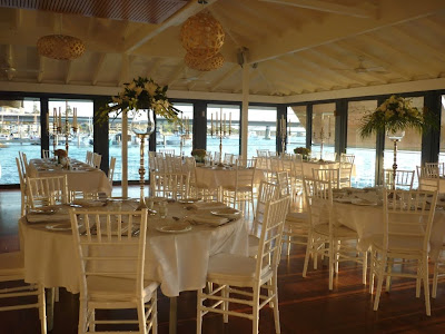  black chairs for the bridal table and white chairs for the guest tables