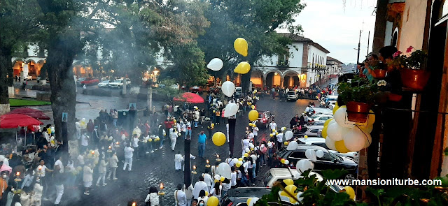 Corpus Christin parade passing in front of Hotel Mansion Iturbe in Patzcuaro