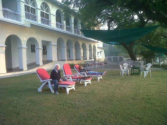 Guest relaxing at Brij Raj Bhawan Palace Lawn