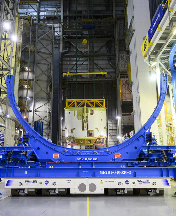 At NASA's Michoud Assembly Facility in New Orleans, Louisiana, engineers are about to place the engine section for the Space Launch System's Artemis 2 core stage booster into horizontal position...on February 11, 2023.