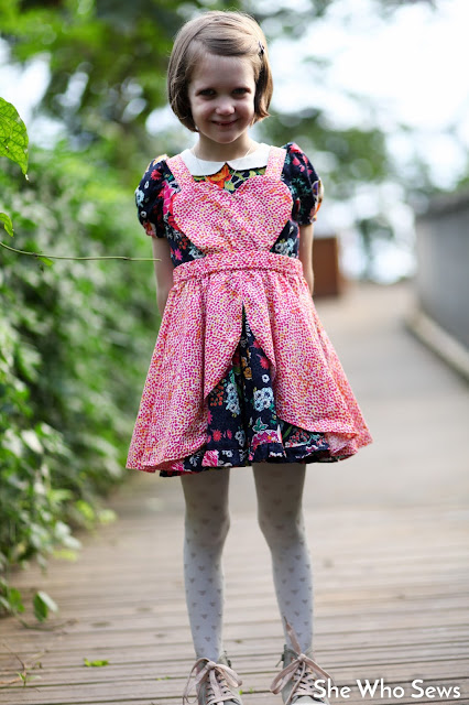 dark dress with red pinafore