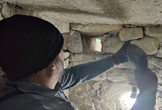 Halil drilling out the stones for a new window