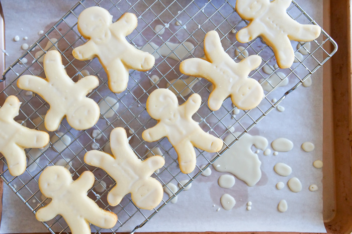 glazed cookies over rimmed cookie sheet to catch drips