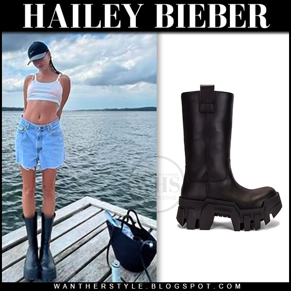Hailey Bieber in white crop top, denim shorts and black boots