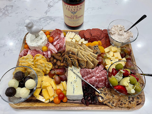 charcuterie tray of cheeses, crackers, meats, and fruit