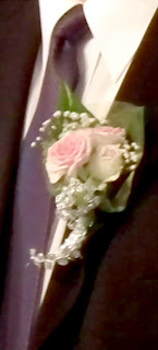  Boutonniere with pink roses and scented pelargoniums leaves