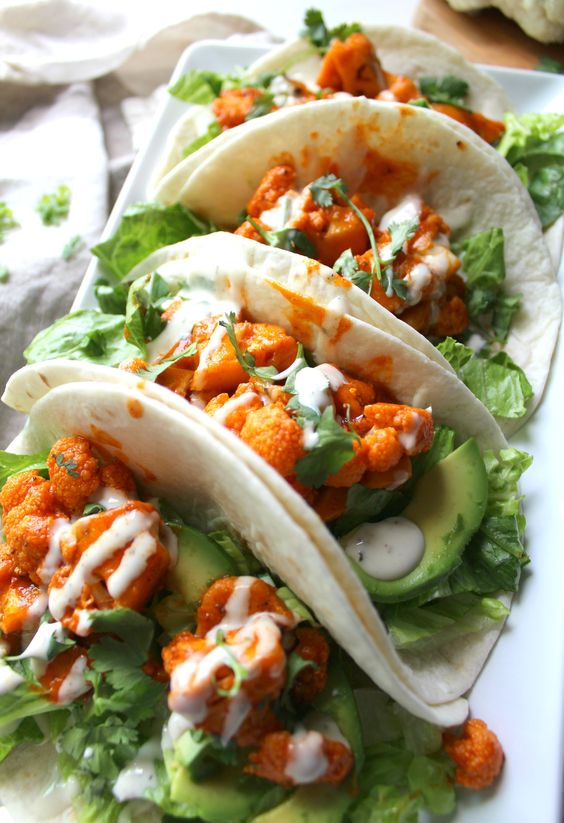 These Vegan Buffalo Cauliflower Tacos are packed full of spicy buffalo sauce, creamy ranch, crunchy romaine and hearty avocados.