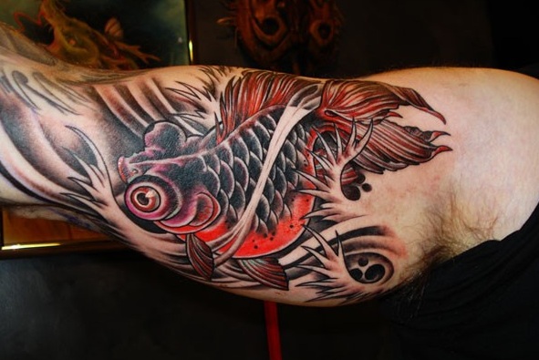 chinese goldfish tattoo. The goldfish is considered to