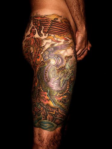 Dragon Tattoo A man upper leg tattooed beautiful phoenix and dragon tattoo