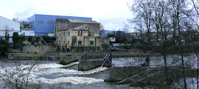 Weir on the Creuse at the papermill, Descartes.  Indre et Loire, France. Photographed by Susan Walter. Tour the Loire Valley with a classic car and a private guide.