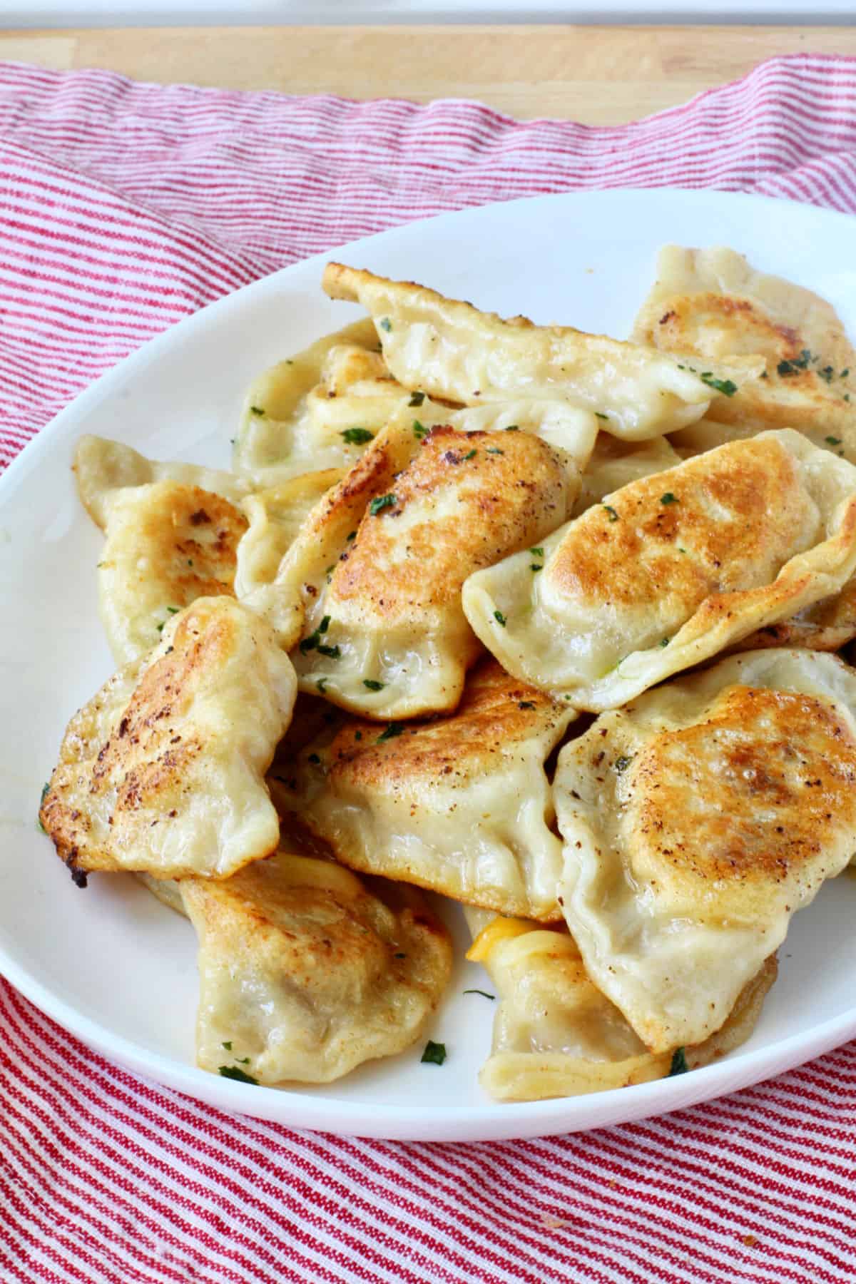 Twice-Baked Potato Pierogies on a white tray.