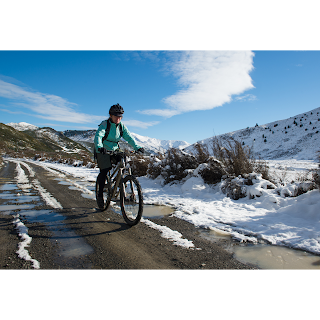 Cyclist riding in winter