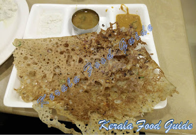 Image of Rava Dosa with chutneys and sambhar.