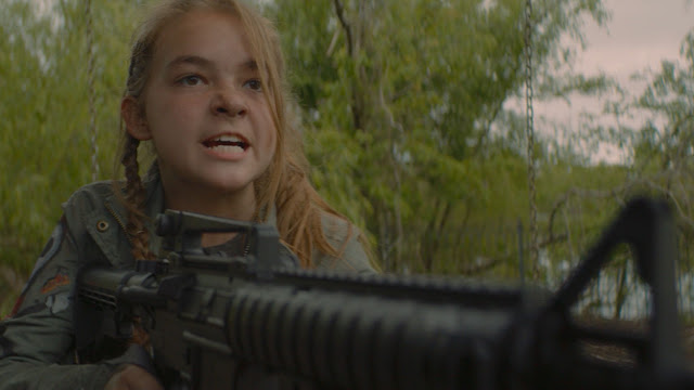 teen girl with a machine gun