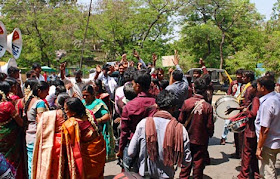 People dancing at a wedding celebration on the road