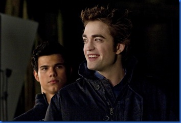 Taylor Lautner stands behind Robert Pattinson during scene blocking, "New Moon" April 24, 2009