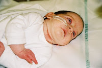 Abigail in her hospital cot