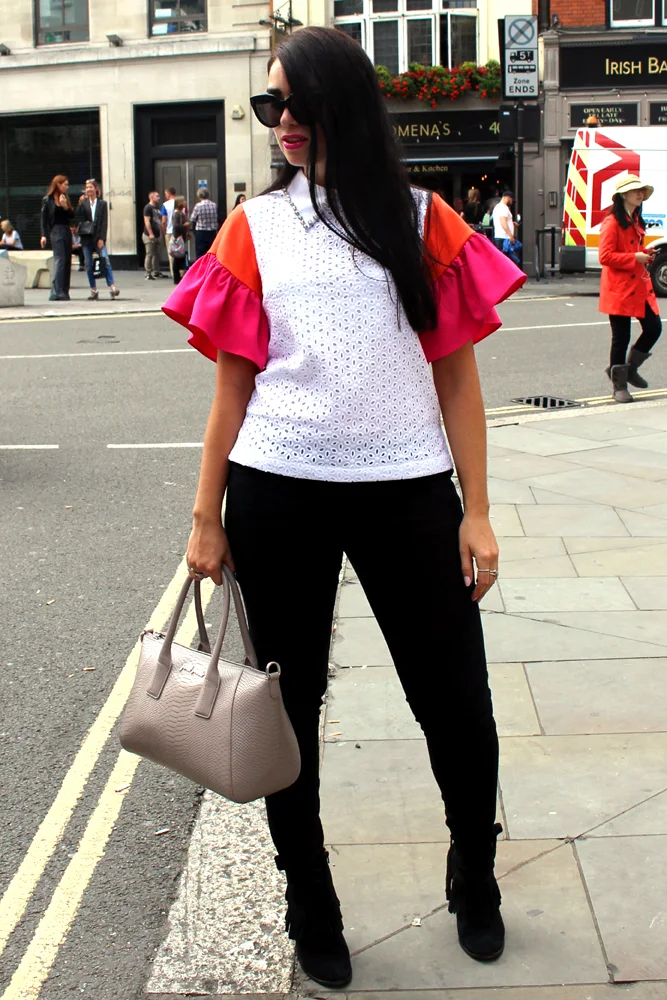 Emma Louise Layla in Cici London ruffle blouse at London Fashion Week