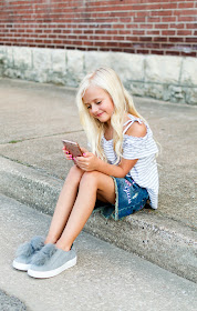 little girl fashion outfit denim skirt patches fur pom shoes sneakers off the shoulder