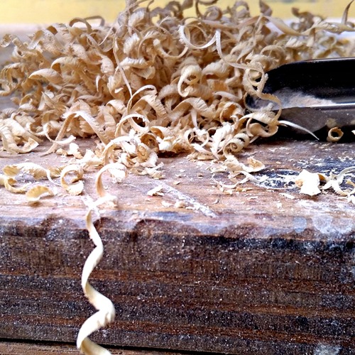 wood shavings and chisel