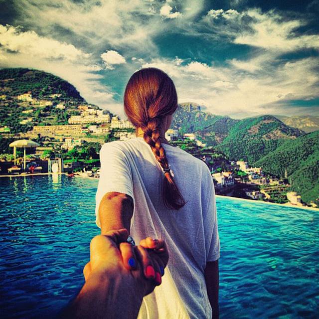 Photographer Murad Osmann creatively documents his travels around the world with his girlfriend leading the way in his ongoing series known as Follow Me To. Chronicling his adventures on Instagram, the Russian photographer composes each shot in a similar fashion. We see each landscape from the photographer's point of view with his extended hand holding onto his girlfriend's in front of him.