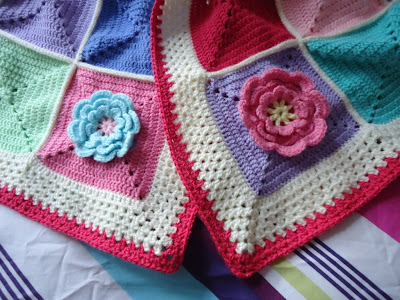 A beautiful colourful crochet blanket with a lovely waterlily design - click through for inspiration for a stunning cosy flower crochet blanket.