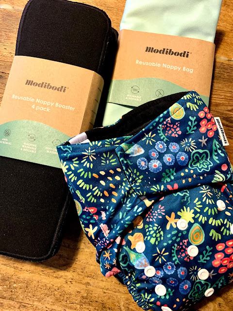 Modibodi reusable nappy plus booster liners and nappy bag.