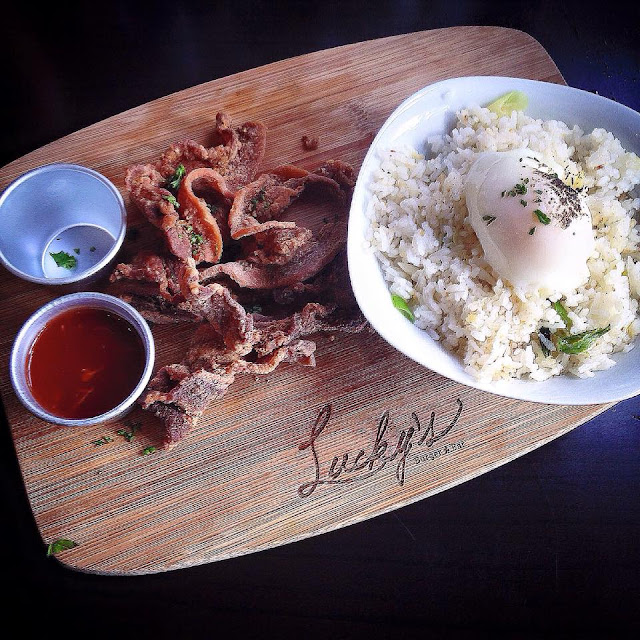 Lucky's Burger & Bar's Crispy Bacon with poached egg  and garlic and chives rice