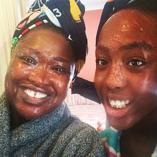 Ruka's Place - freshly applied camwood face mask on a woman and a girl.