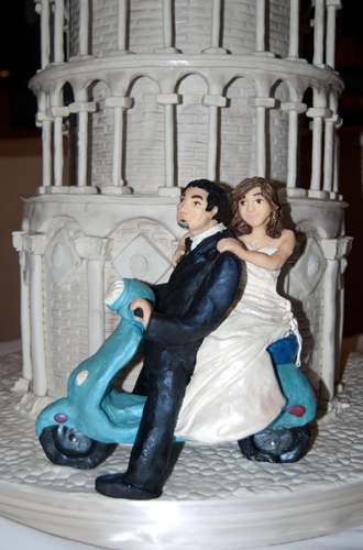 Fascinated by scooters and then to see a wedding cake with the bride and 