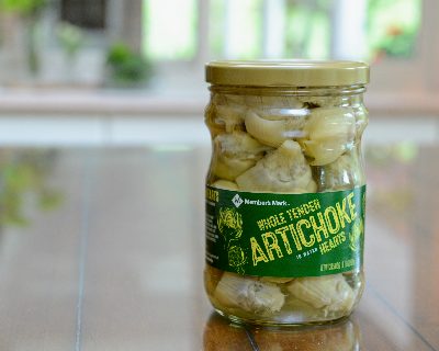 A jar of artichoke hearts for Easy-Easy Artichoke & Tomato Salad, another quick, versatile & healthy salad ♥ KitchenParade.com.