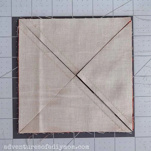 cutting the sewn squares of fabric