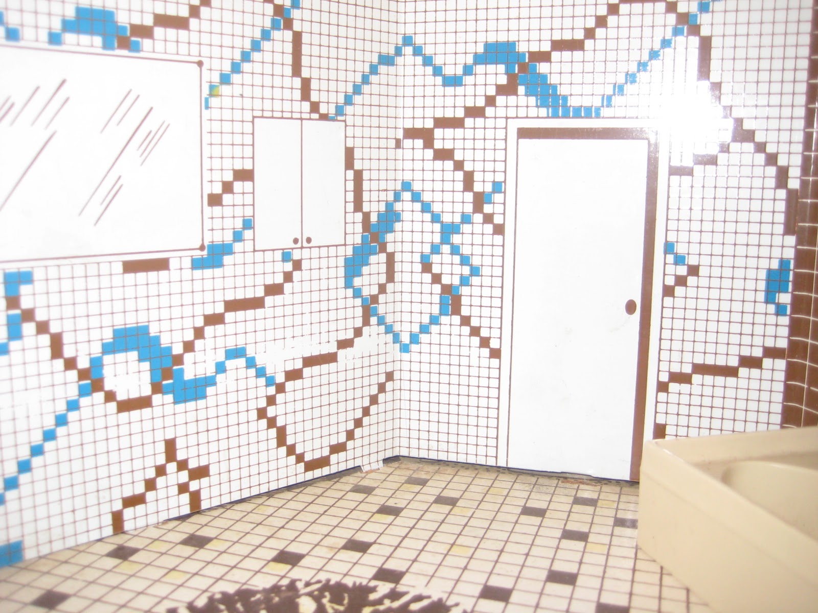 Notice the Mid century modern abstract tile pattern in the bathroom.
