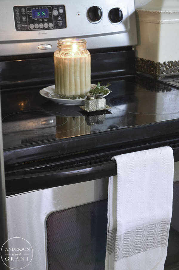 Candle burning on the stove will fill the house with a cozy fall scent.  