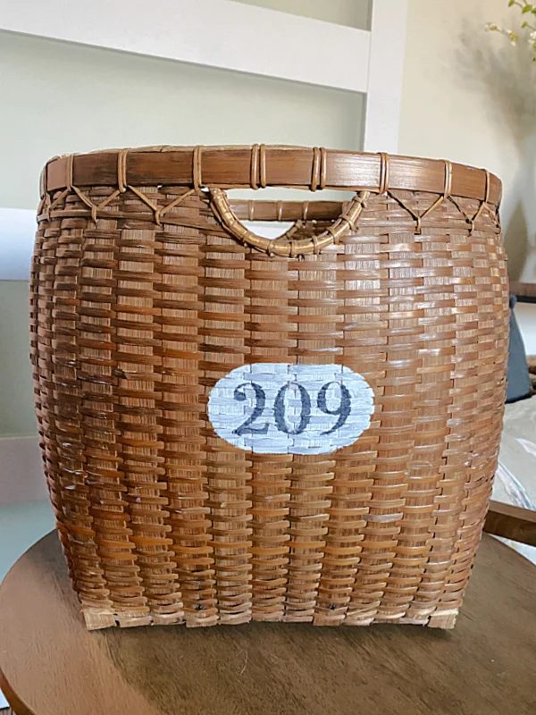 large basket with stenciled numbers