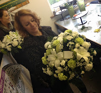 girl making white funeral circle wreath