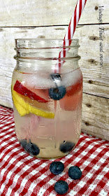 Vintage, Paint and more... making a delicious cool drink with water, strawberries, blueberries and lemons