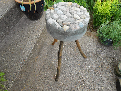 Rustic bucket stool made of concrete