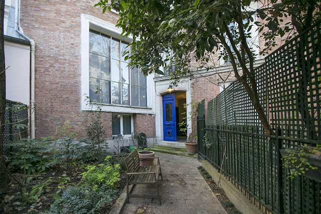 Bright blue door to home on private secret Avenue Frochot in Paris seen on Hello Lovely Studio