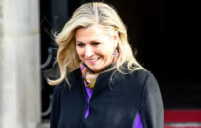 Queen Maxima wore new purple silk blouse by Natan Couture and purple silk trousers by Natan, and a new navy cape coat by Valentino